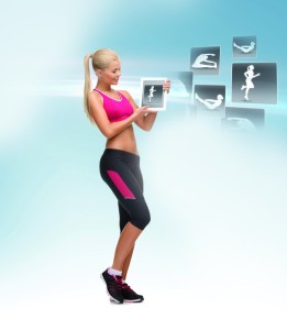 woman holding tablet pc with sport application